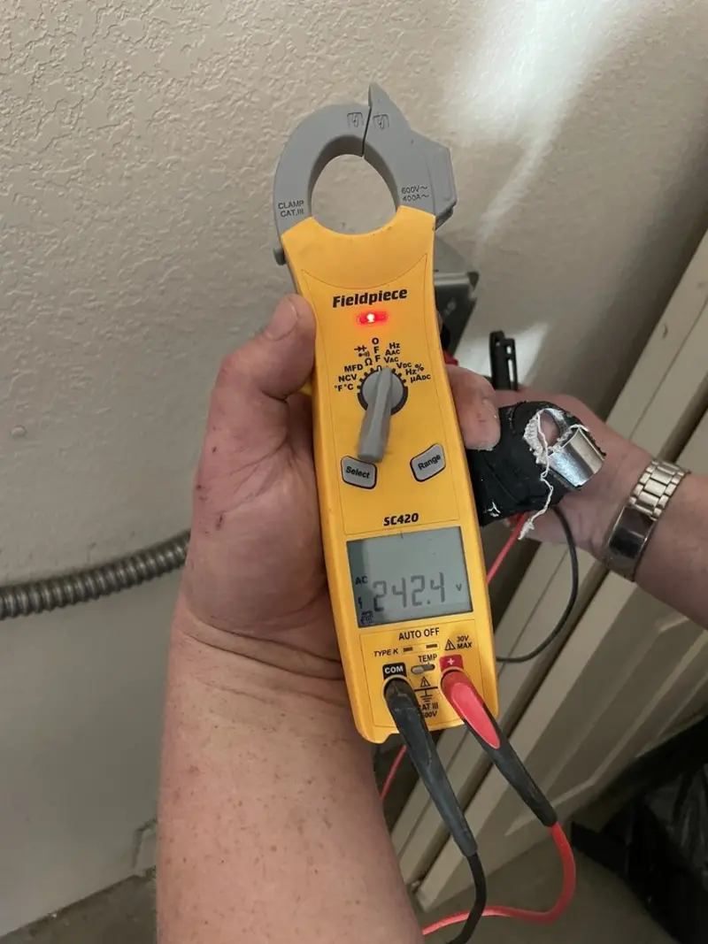 Voltage testing with clamp meter during Recessed Lighting Installation in Fort Lewis